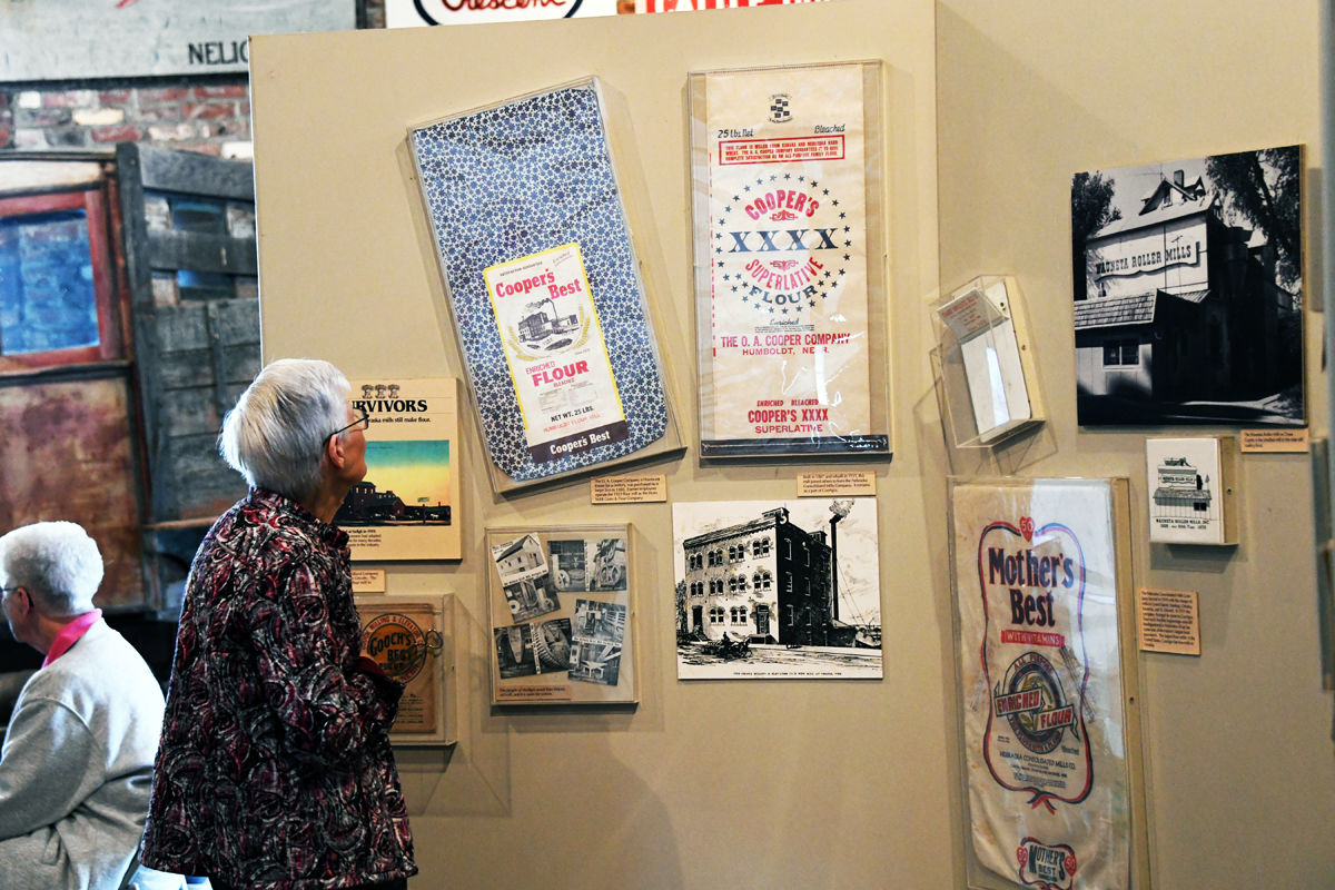 014 Joann Bower views the flour sacks and photos at the mill.JPG